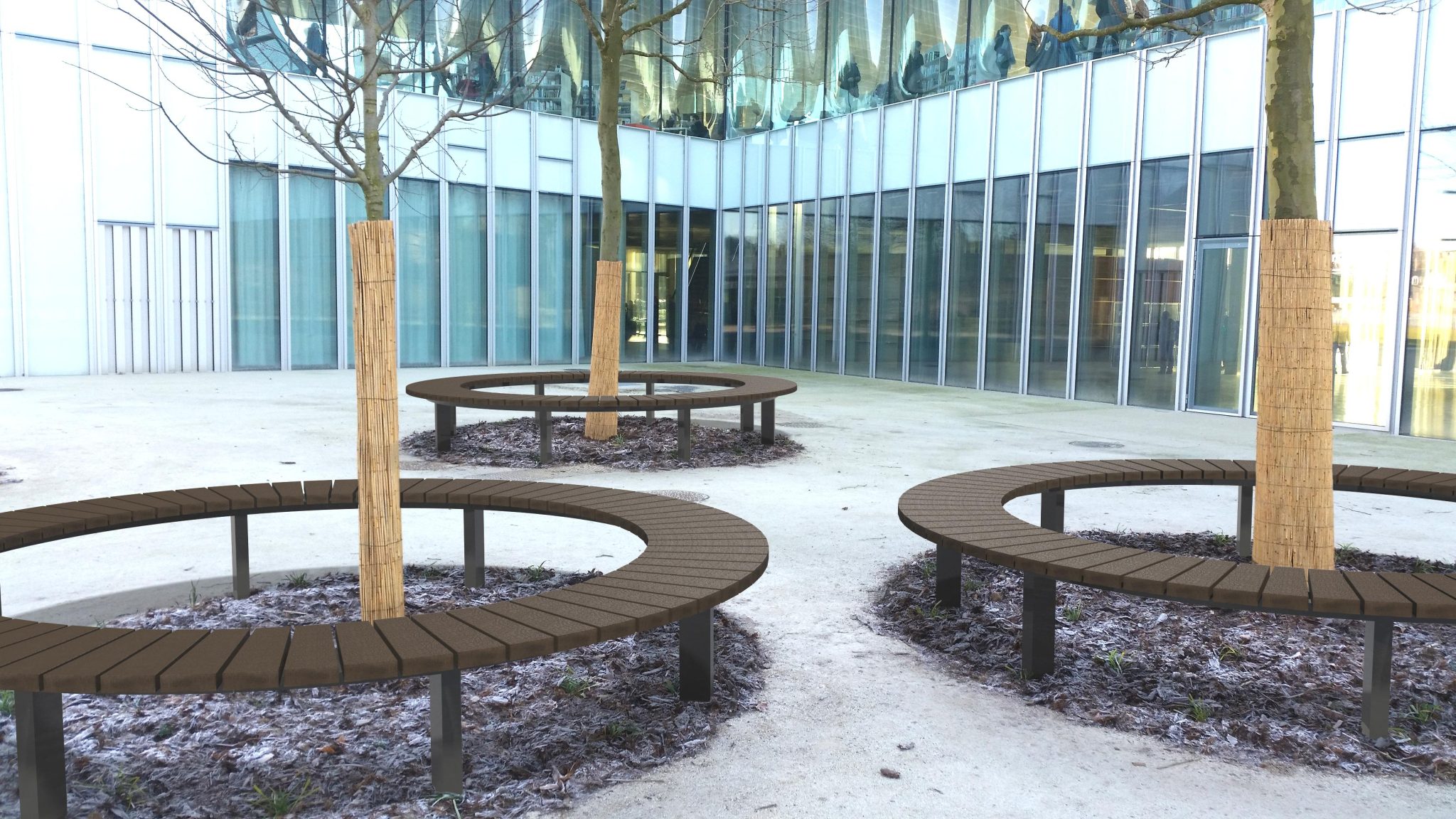 Espace extérieur moderne avec bancs circulaires et arbres.